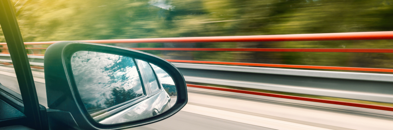 Rearview mirror of a speeding car